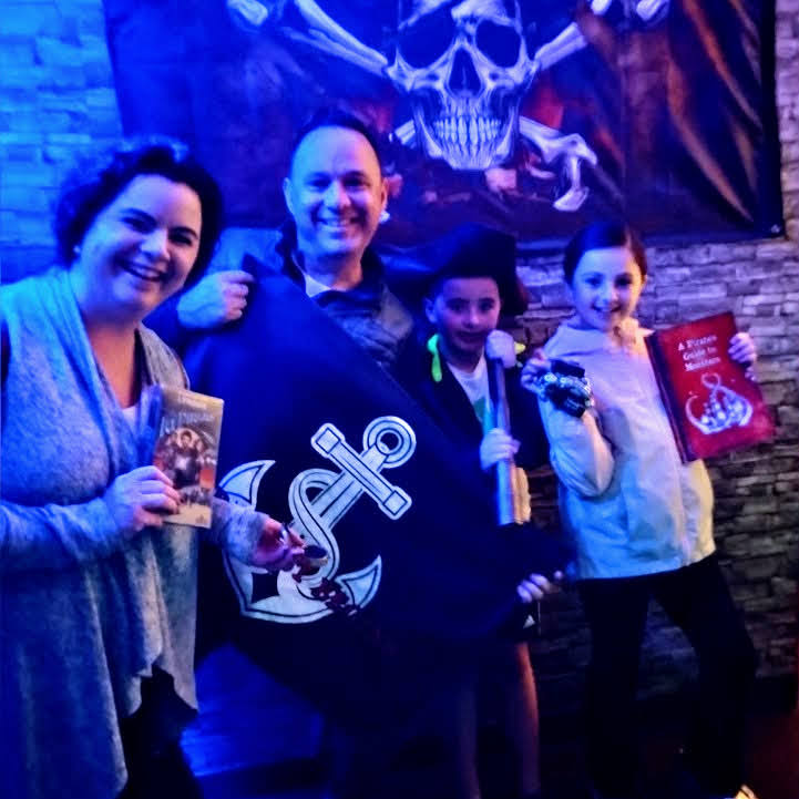 Mom, Dad and child out for Sunday Escape Room Fun at Whole Brain Escape.